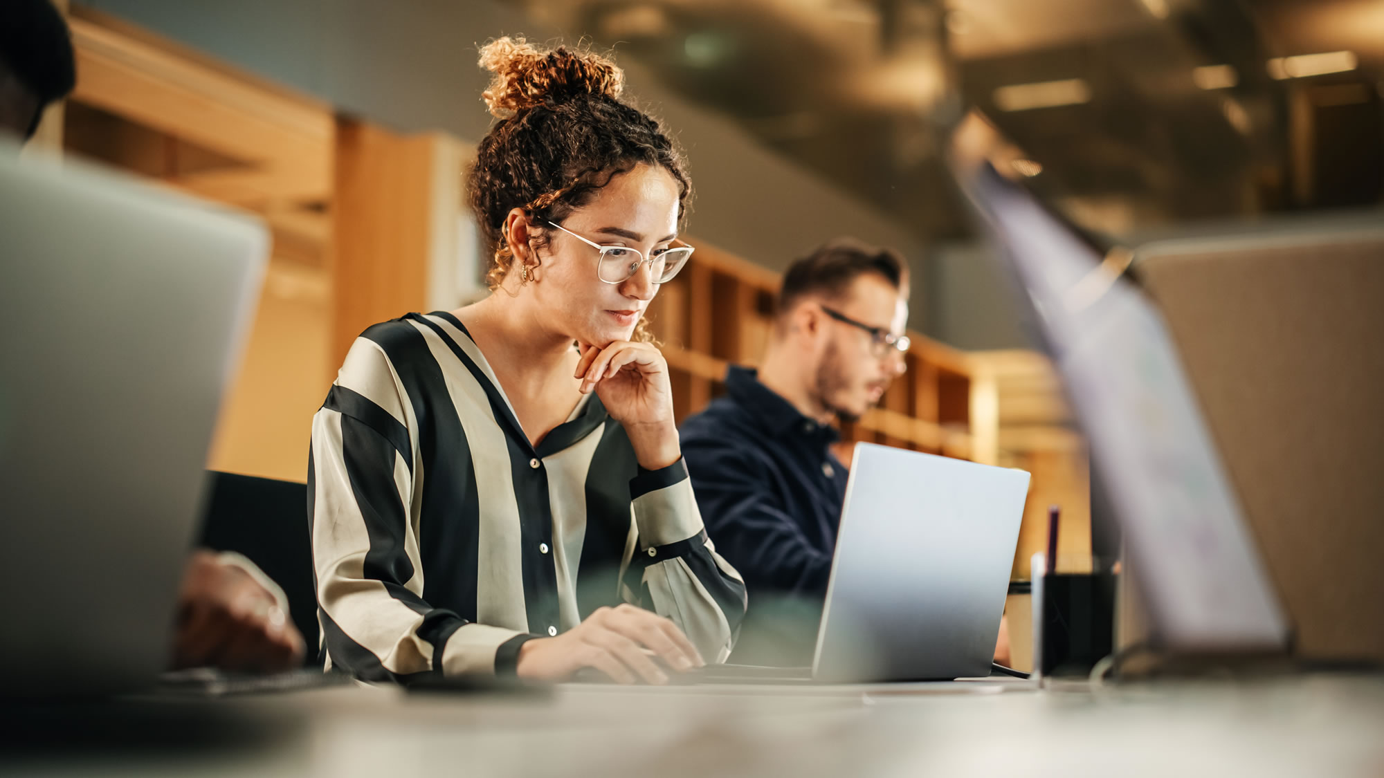 Woman concentrating on her work at a laptop