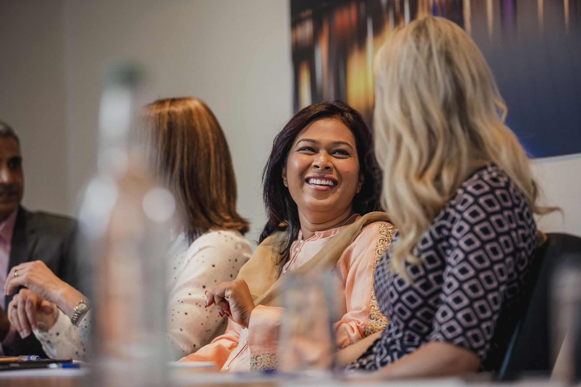 Women connecting and sharing ideas during a professional leadership event